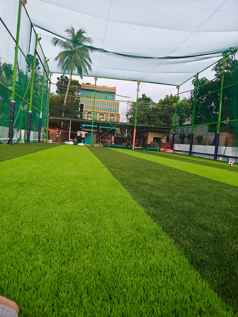Wide daytime turf view under safety netting