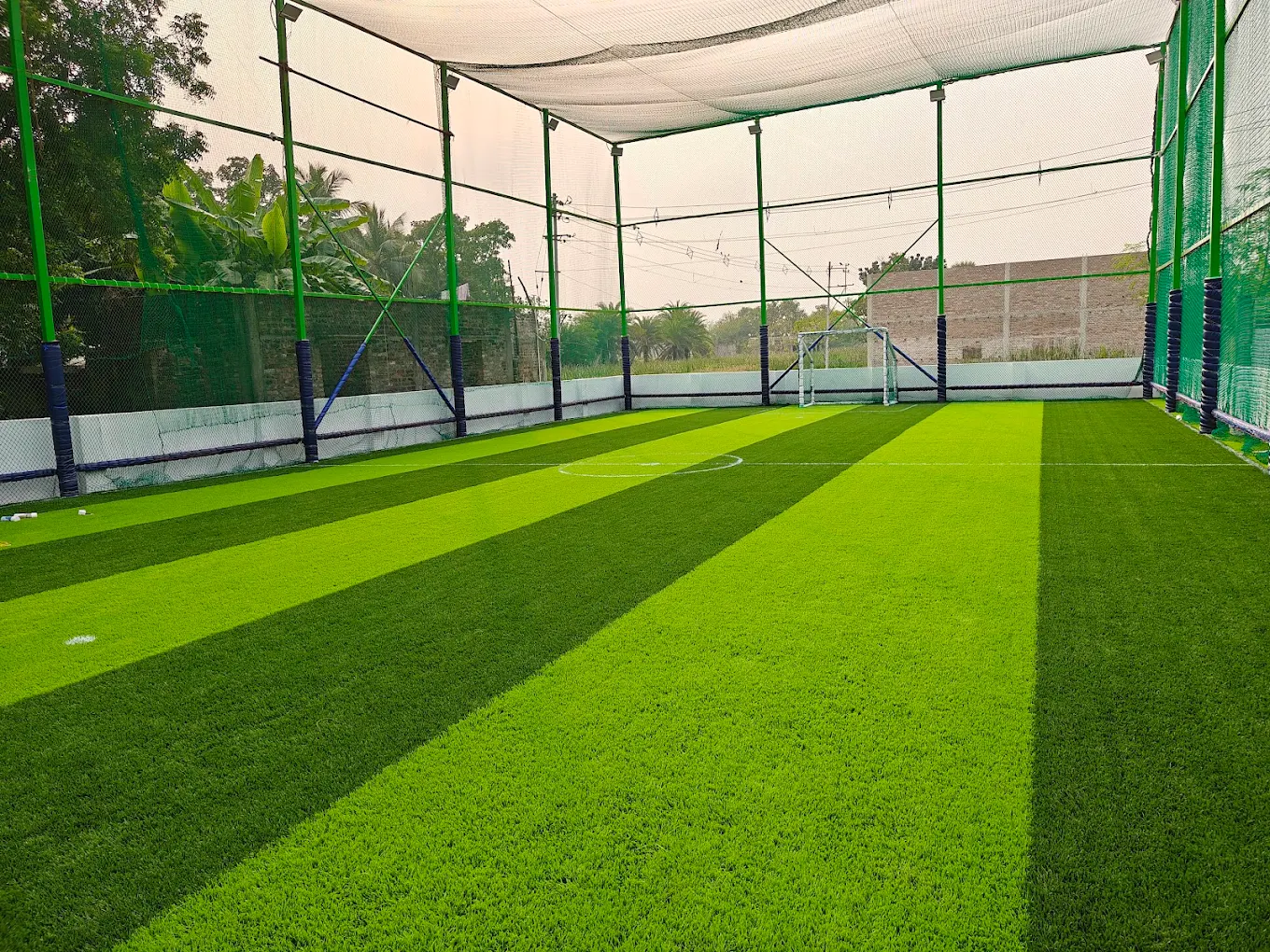 Green football turf with goal post